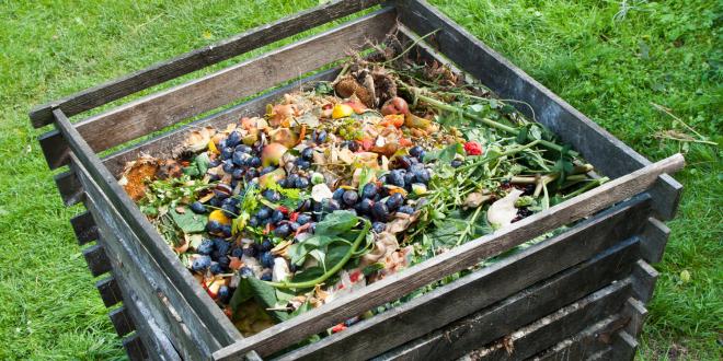 A slotted crate full of compostable materials
