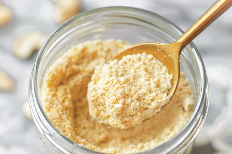 a jar of powdered vegan cheese